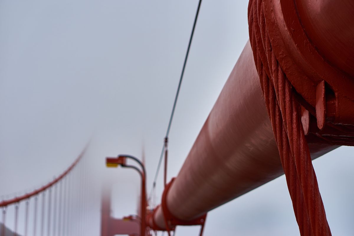 The Golden Gate Bridge disappears in the fog